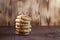 Shortbread cookies are stacked on a wooden background. Pastries are handmade