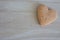 Shortbread heart on wooden background with copy space as love background.