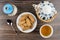 Shortbread in saucer, teapot, sugar bowl and cup of tea