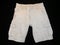 Shorts beige, front side, on black background