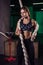 Shot of an attractive female crossfit athlete with a rope at the gym.