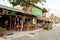 Shot of a bar restaurant and a golf cart taxi on a sandy street, Holbox, Mexico