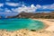 Shot of beautiful turquoise beach Falasarna Falassarna in Crete, Greece. View of famous paradise sandy deep turquoise beach of