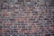 Shot of a brown and red cemented brick wall - great for wall papers