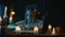 Shot capturing a young woman sitting at the table, surrounded by candles, crosses and beads, having an ouija board