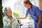 Shot of a carer at a nursing home with her patient