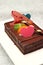 Shot chocolate cake topped with fresh fruit