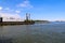 A shot of the dredging rig in the Savannah River with vast river water, blue sky and clouds