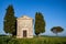 shot of the famous historic Chapel Vitaleta in the middle of a field in Italy