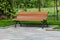 Shot of a free bench in a park surrounded by fresh green grass