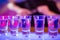 Shot glasses on illuminated bar counter