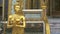Shot of a golden angel statue at the side entrance of the golden buddha temple in bangkok