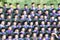 Shot of graduation caps during commencement. The image was blurred for use as a background.