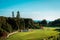 Shot of the Grand Hotel`s gardens on a sunny day with the Mackinac bridge in the background