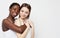 Shot of happy interracial homosexual couple hugging.African-American girl and her charming Caucasian girlfriend.