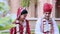 Shot of Indian bride and groom performing religious ritual in lawn at Hotel Amar Villas, Agra, Uttar Pradesh, India