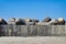 Shot of a lot of marine concrete tetrapods on the background of the clear sky