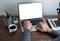 shot of man hand has watch on his wrist using keyboard of laptop computer blank screen.