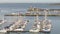 Shot of many yachts docked and lined up in a bay