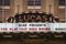 A shot of the marquee in lights on top of theLucas Theatre For the Arts with black and red letters at sunset in Savannah Georgia