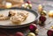 Shot of mince pies served on a plate, a beautiful composition of Christmas balls and yummy dessert