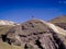 Shot of a person contemplating the snowy mountains heading to the rainbow mountain in Cusco, Peru.