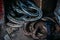 Shot of a person working with a Horse farrier, hoof and metal work to make horse shoes