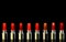 Shot of red lipsticks of different color.  on black background. Cosmetics concept. Beautiful Luxury Modern High