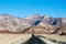 Shot of a  road  near the massive mountains in Death Valley National Park, California USA