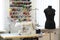 Shot of seamstress workplace. Fashion Design Studio. Sewing Machine and Various Sewing Related Items on the Table