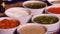 Shot of several small bowls of different sauces