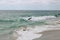 A shot of a surfer crashing into the waves at 1000 Steps Beach