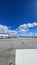 A shot of the tarmac at the Ontario International Airport with planes and runways, blue sky and clouds in Ontario California