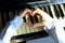 Shot Of An Unidentifiable Female Hands Making A Heart Shape Over A Piano.