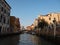 Shot of Venice canal with buildings and bridge over a canal