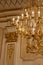 Shot of the vintage heraldic ceiling and chandelier in the castle. Concept