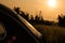 Shot of Volkswagen beetle car\\\'s back portion with a sunset background