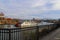 A shot of a white and red steam boat sailing on the Cumberland River near the John Seigenthaler Pedestrian Bridge