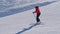 Shot of Woman Skis Carving Down The Slope In The Mountains Ski Resort At Winter