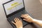 Shot of a woman working on the laptop showing an excel sheet on the screen with bank loan amortization table. Accounting