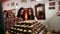 Shot of a women taking chocolate pralines in shop