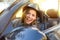 Shot of a young cute woman enjoying a drive in a convertible loving the breeze in her face