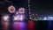 Shots and explosions of colorful fireworks over the sea, lake. A short video of colorful New Year\'s fireworks