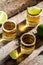 Shots of Mexican Gold Tequila with lime and salt on rustic wooden background. Alcoholic drink concept. Mexican national drink