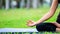Shots of young woman practicing yoga in nature. Sit on green grass at golden light at sunset . Communicate to exercise and