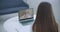 Shoulder view young woman consulting with family therapist doctor general practitioner online via video call on laptop