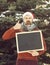 Shouting santa with blank chalkboard