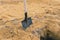 Shovel in the sand. Tool for construction work and work on the land. Planting trees and plants