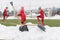 Shovels in the pile of snow after cleaning snow from the soccer