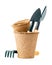 Shovels and rakes in peat pot for working in the garden isolated